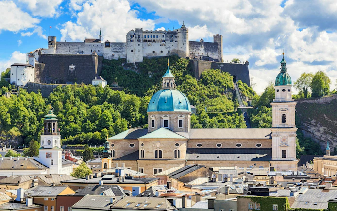 Hohensalzburg Fortress overlooking Salzburg cityscape, Austria.