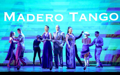 Performers dancing on stage at Madero Tango Show in Buenos Aires.