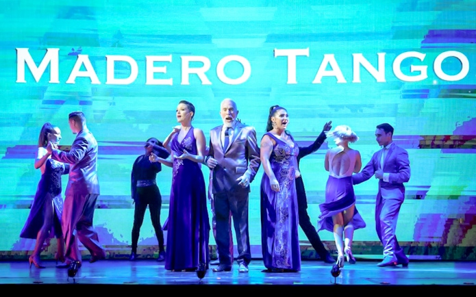 Performers dancing on stage at Madero Tango Show in Buenos Aires.