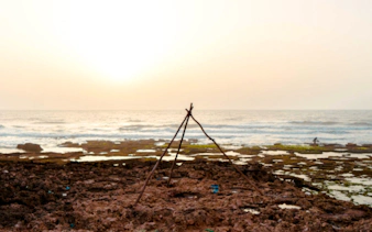 Atlantic shore fishing setup at Oualidia, Essaouira during sunrise.