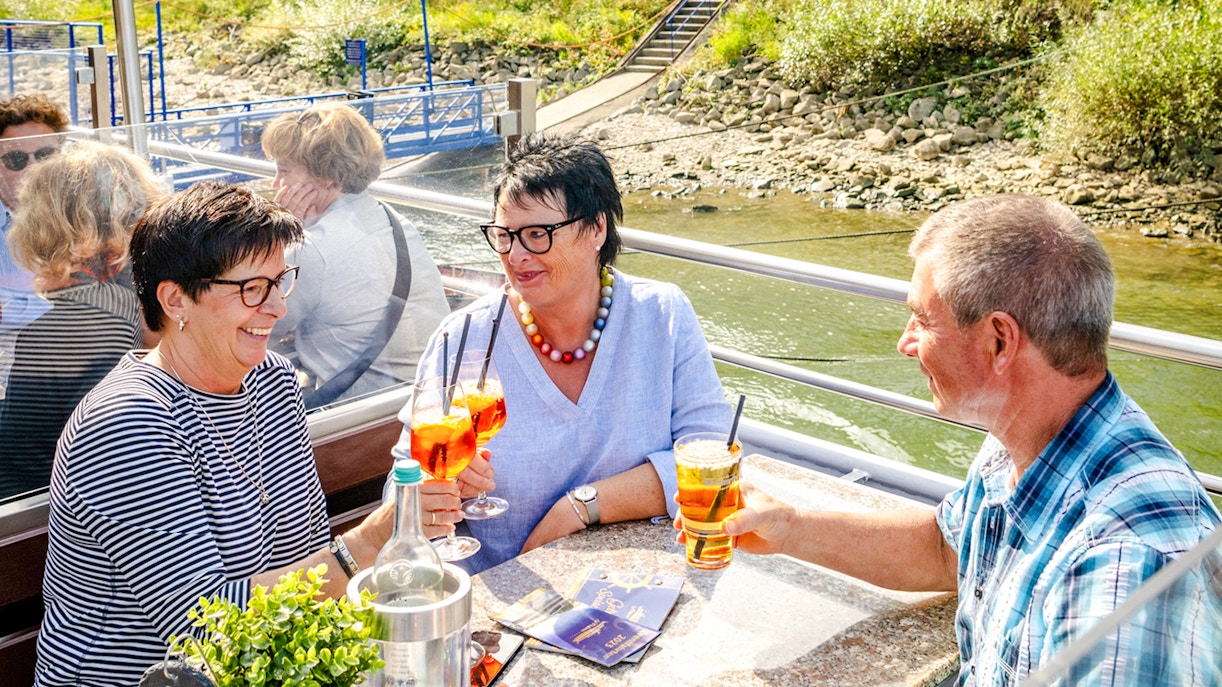 Koblenz cruise guests enjoying drinks on deck.