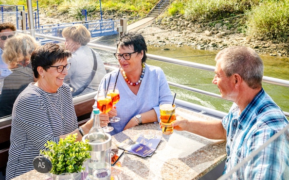 Koblenz cruise guests enjoying drinks on deck.