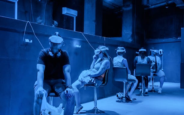 Visitors experiencing virtual reality at Jules Verne 200: Le Voyage immersif exhibit.