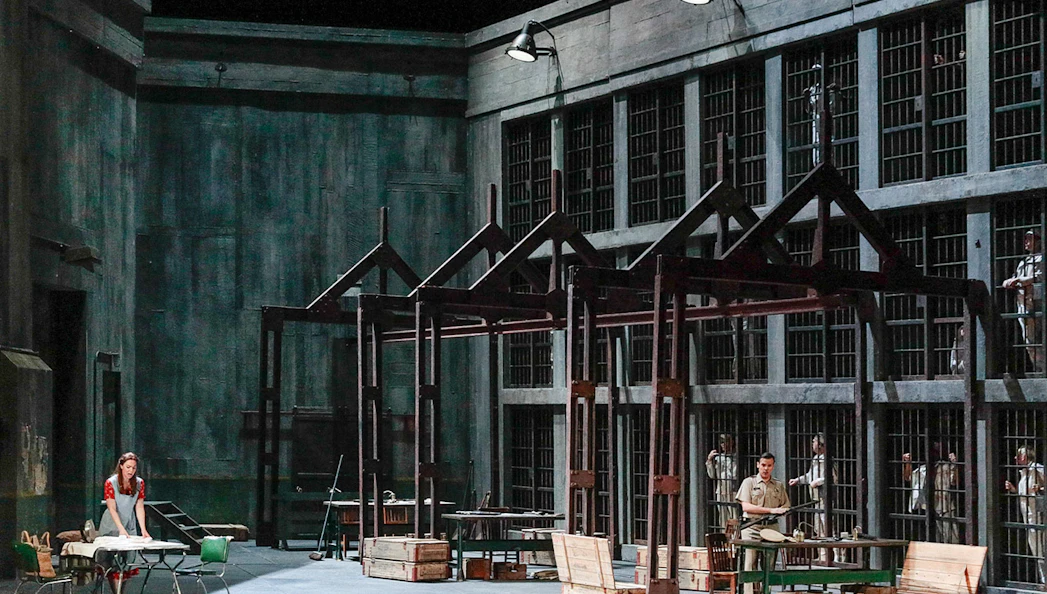 Metropolitan Opera's Fidelio prison scene with performers on stage.