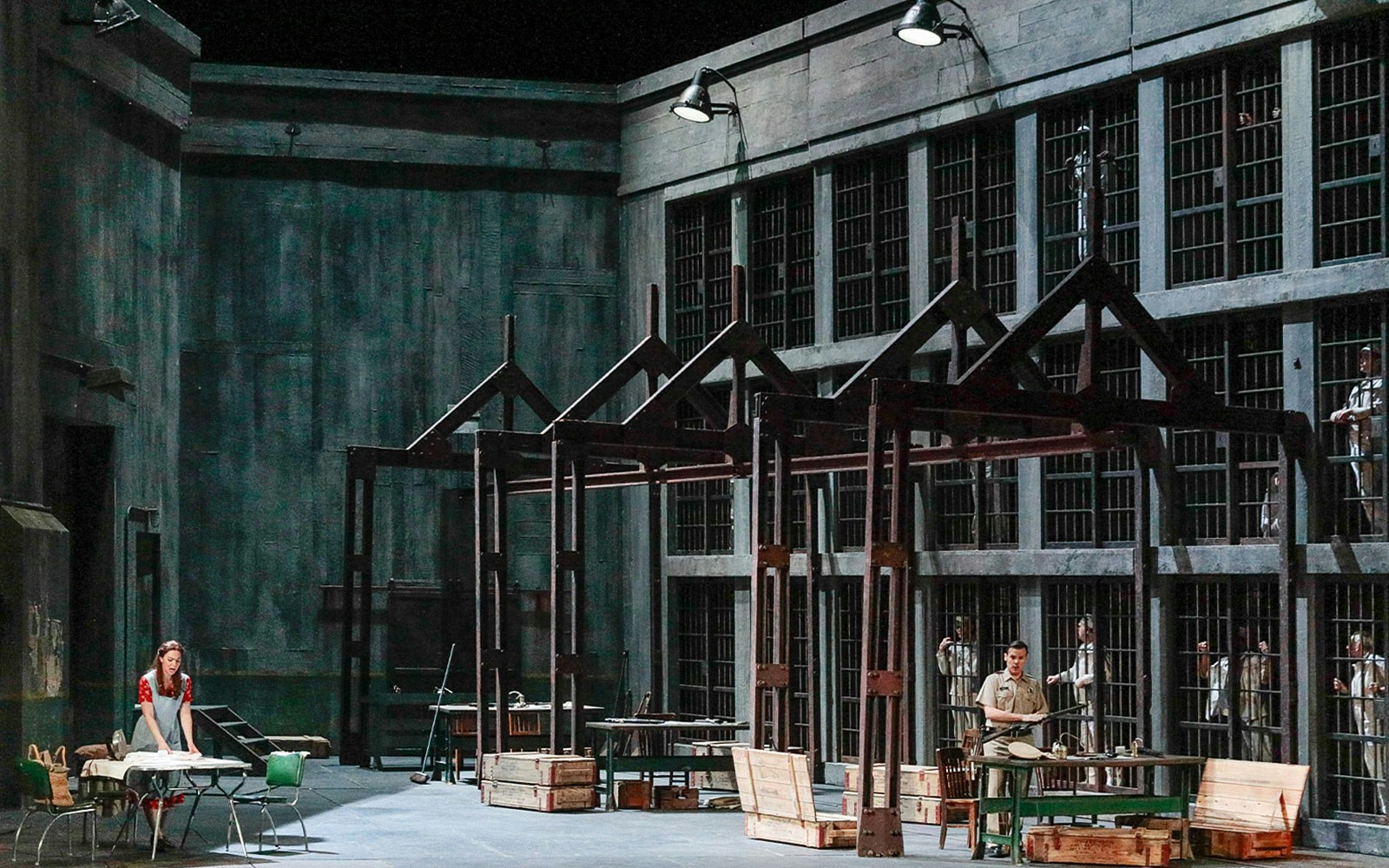 Metropolitan Opera's Fidelio prison scene with performers on stage.