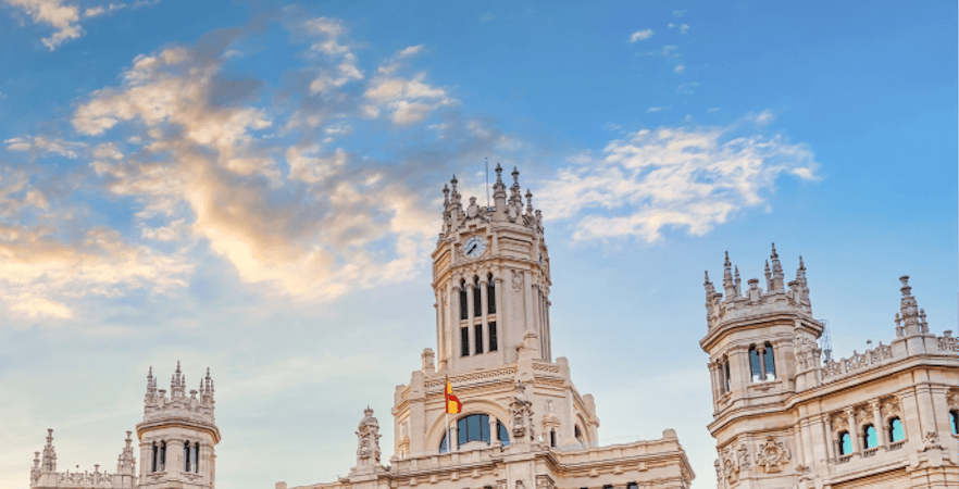 Madrid cityscape with Royal Palace and Almudena Cathedral in the background.