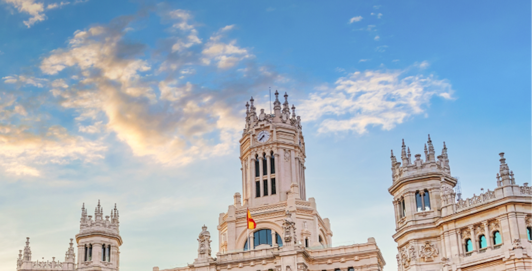Madrid cityscape with Royal Palace and Almudena Cathedral in the background.