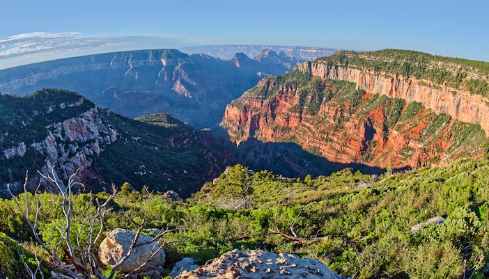 Grand Canyon view from Uncle Jim Point with expansive canyon landscape and rugged cliffs.
