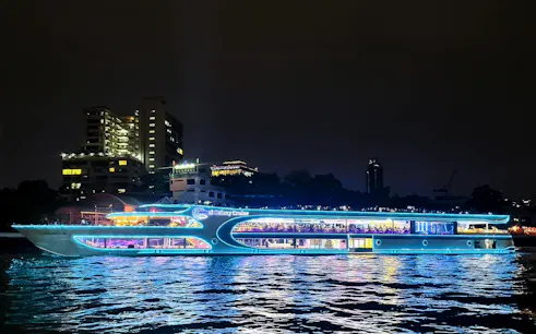 Royal Galaxy cruise ship illuminated on the Chao Phraya River at night, Bangkok.