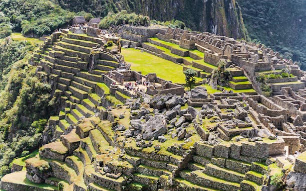 Terraced stone structures and ruins at Machu Picchu stone quarry, Peru.