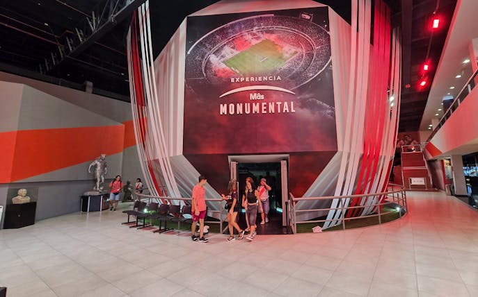 Inside the River Plate Museum at Estadio Mâs Monumental, Buenos Aires, with visitors exiting.