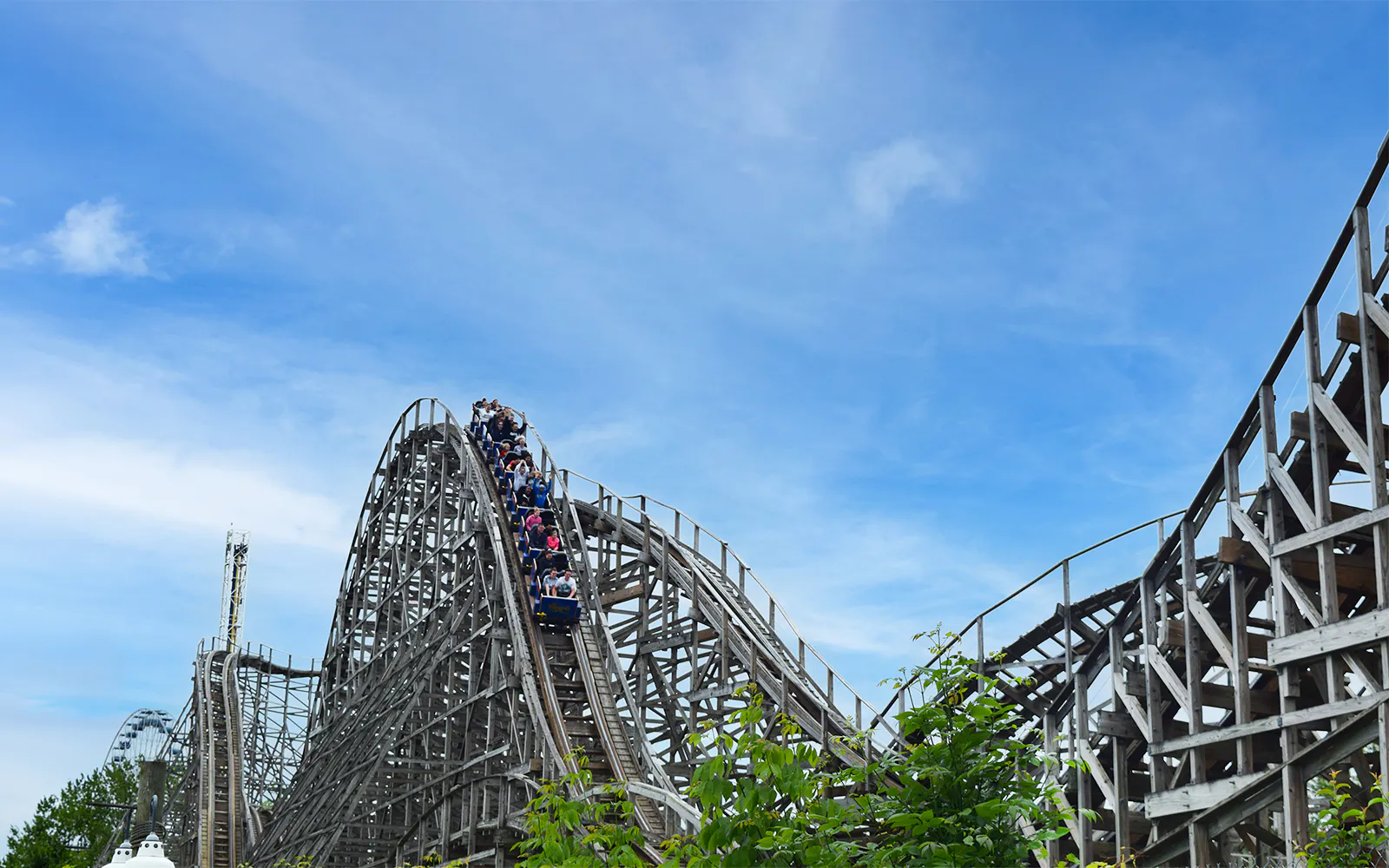 Roller coaster at Six Flags Darien Lake, Predator ride with passengers descending.