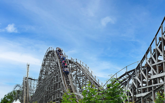 Roller coaster at Six Flags Darien Lake, Predator ride with passengers descending.
