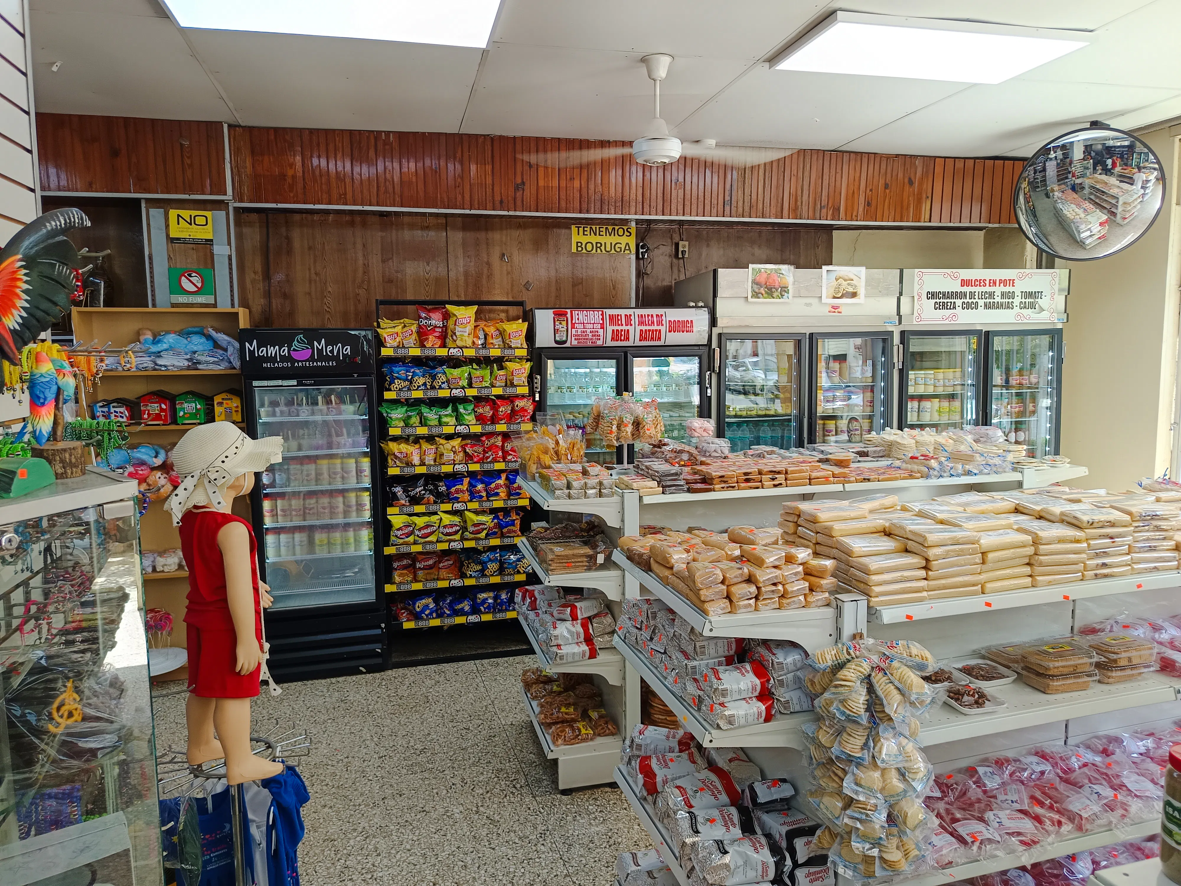 Local market in Santo Domingo with snacks and traditional sweets on display, part of the food walking tour.