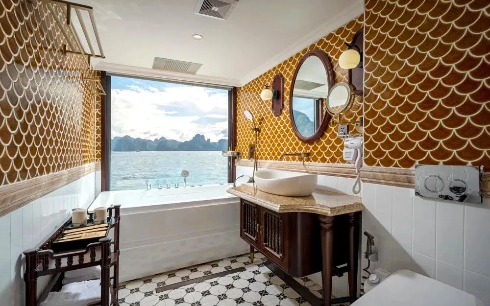 Luxurious bathroom with sea view on Ha Long Bay 5-Star Premium Cruise.