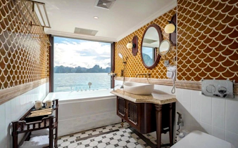 Luxurious bathroom with sea view on Ha Long Bay 5-Star Premium Cruise.