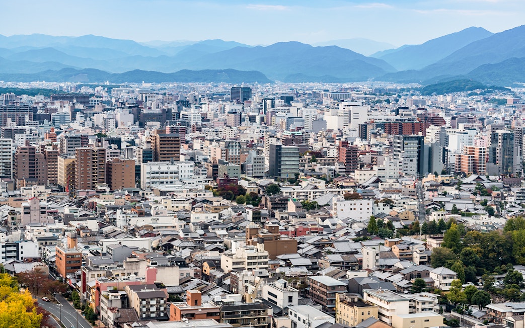 Kyoto cityscape with distant mountains viewed from Kyoto Tower.