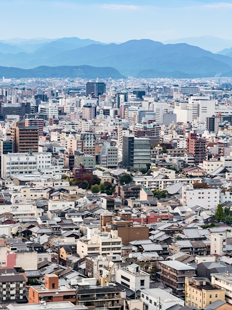 Kyoto cityscape with distant mountains viewed from Kyoto Tower.