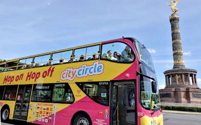 Hop-on hop-off bus near Berlin's Victory Column on City Circle tour.