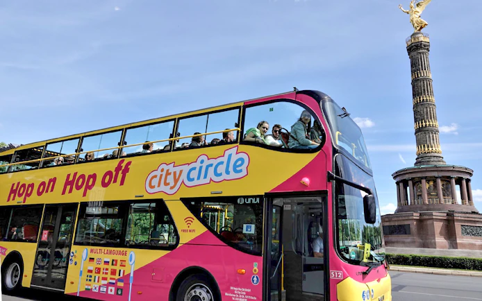 Hop-on hop-off bus near Berlin's Victory Column on City Circle tour.