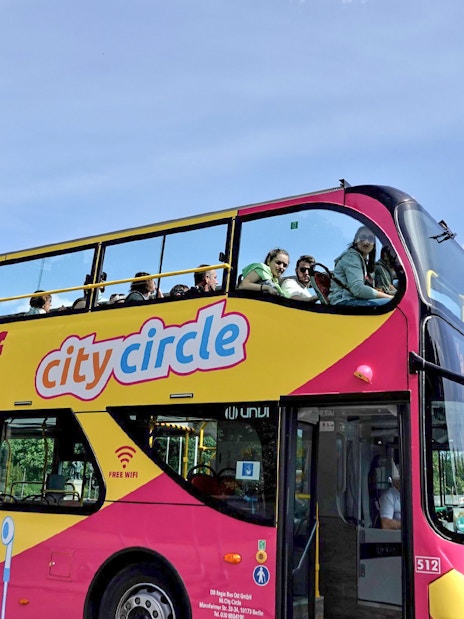 Hop-on hop-off bus near Berlin's Victory Column on City Circle tour.