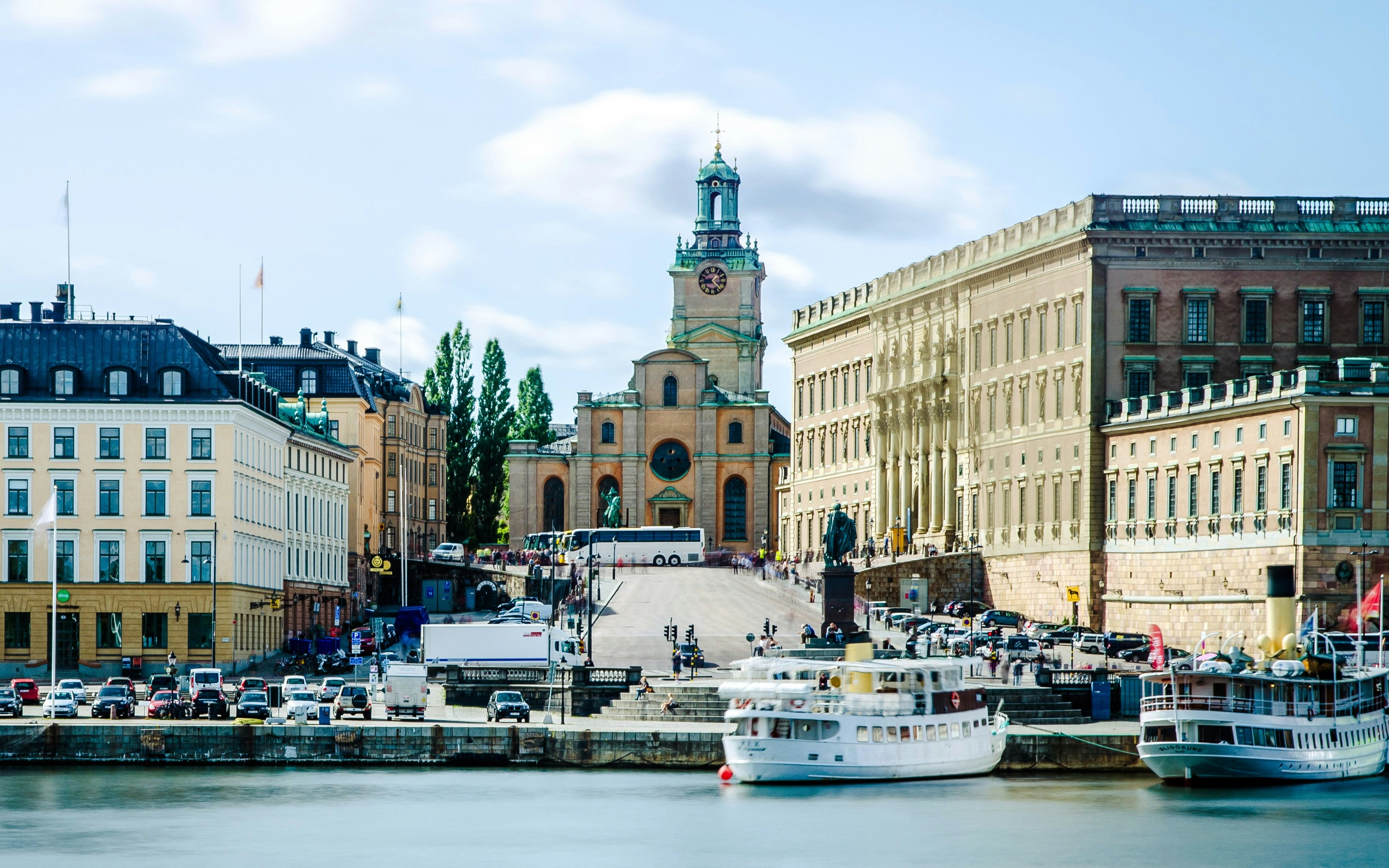 Storkyrkan and Stockholm waterfront with boats and historic buildings.