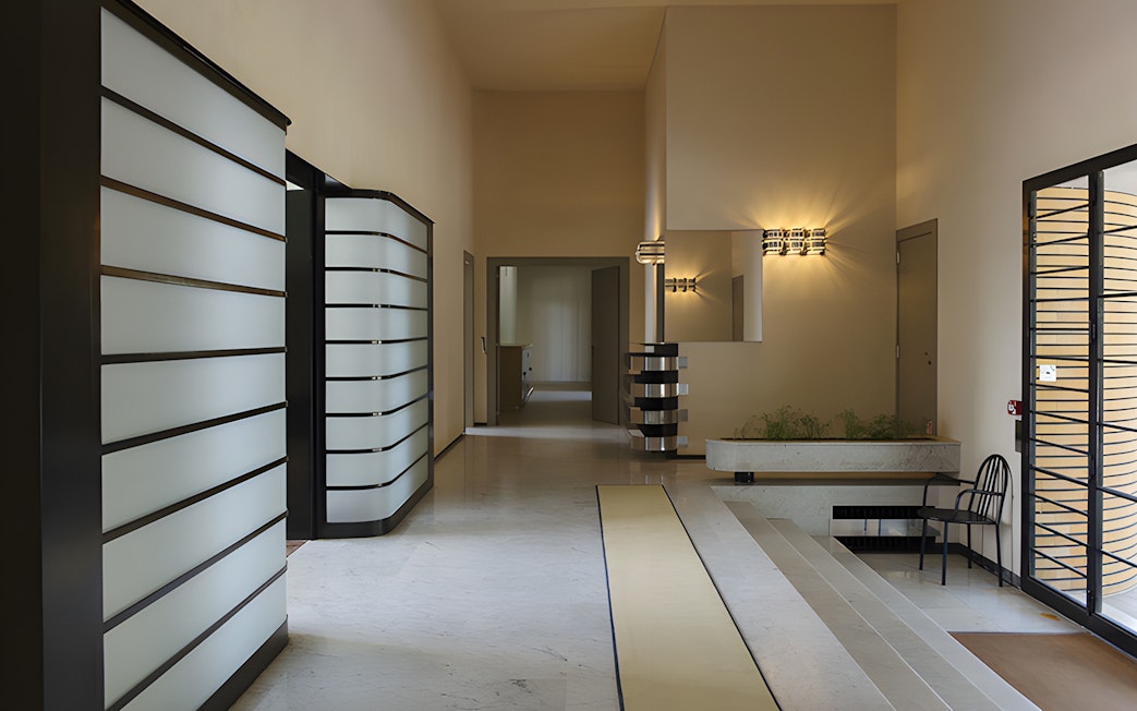 Villa Cavrois interior hallway with modern design elements and lighting fixtures.