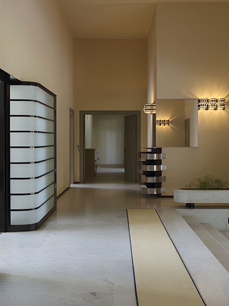 Villa Cavrois interior hallway with modern design elements and lighting fixtures.