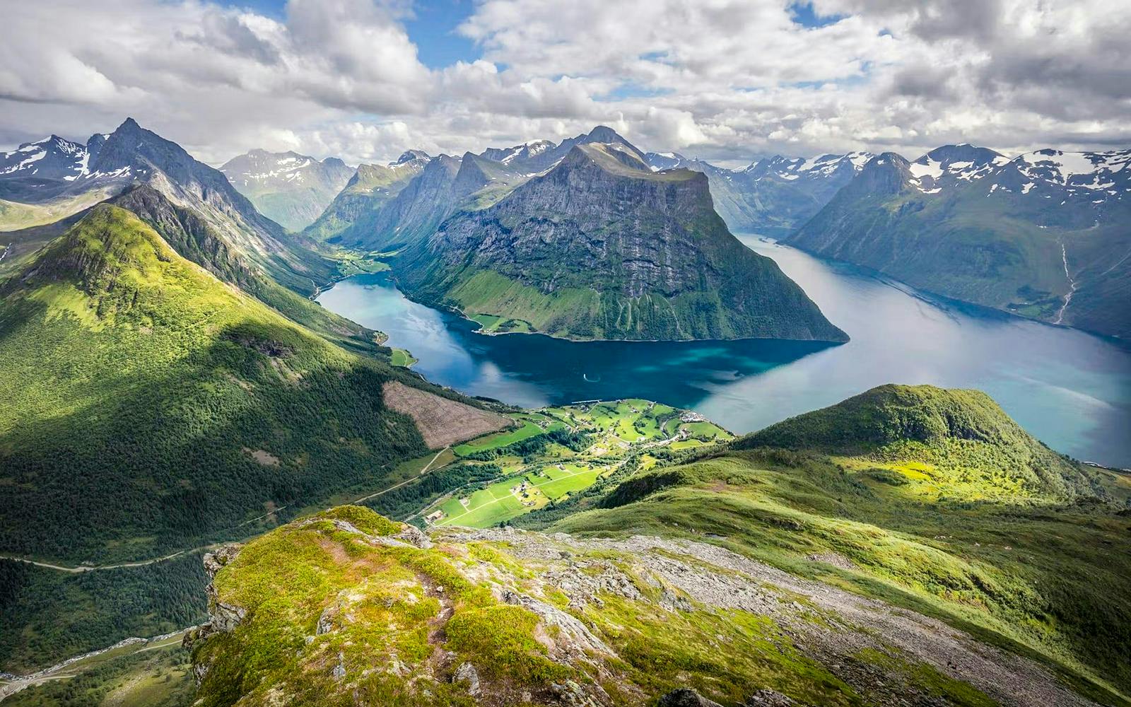 Ålesund-Geiranger fjord view with mountains and lush green valleys.