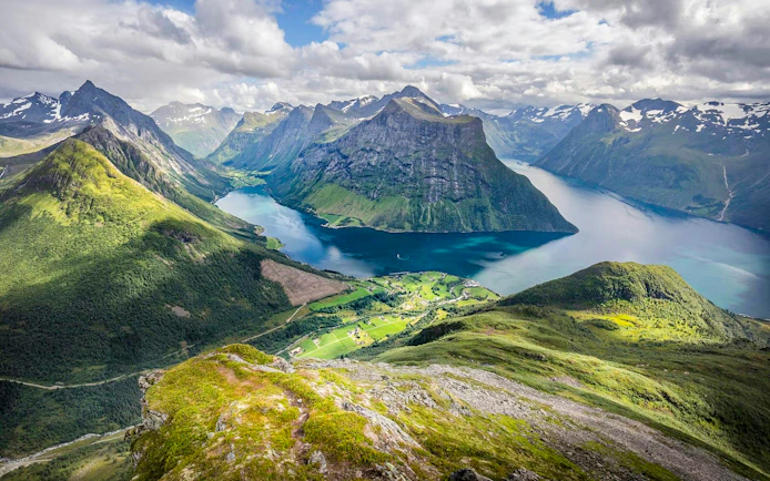 Ålesund-Geiranger fjord view with mountains and lush green valleys.