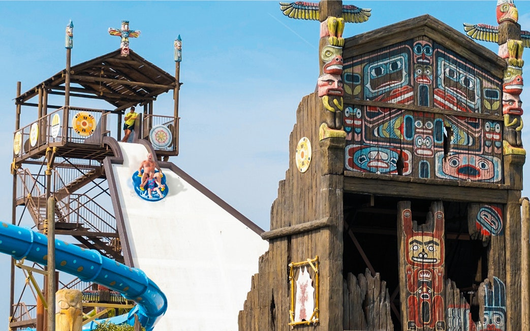 Boomerang water slide at Western Water Park with totem pole decor.