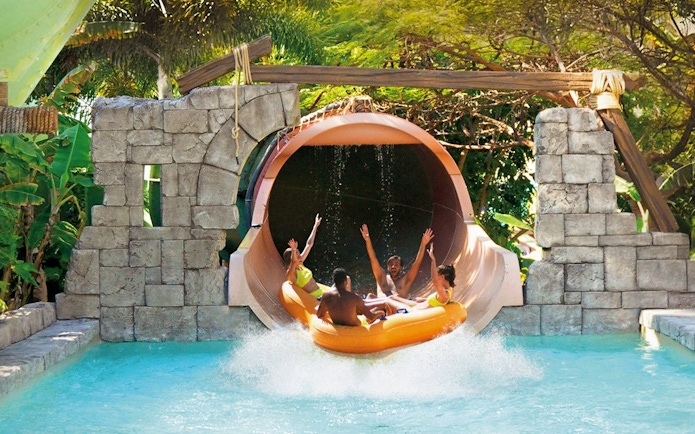 Visitors enjoying Anaconda water slide at Aqualand Maspalomas.