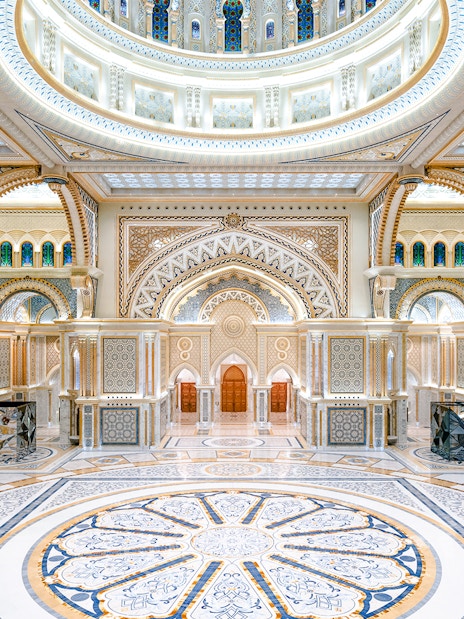 Ornate interior of Qasr al Watan in Abu Dhabi with intricate patterns and grand arches.