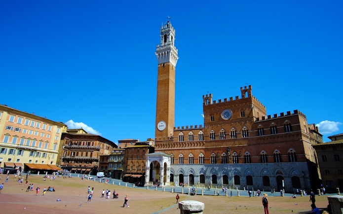 Piazza del Campo in Siena with Torre del Mangia, Italy.