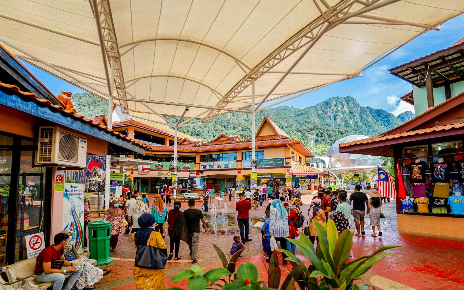 Langkawi Cable Car ascending over lush hills near Oriental Village shopping area.