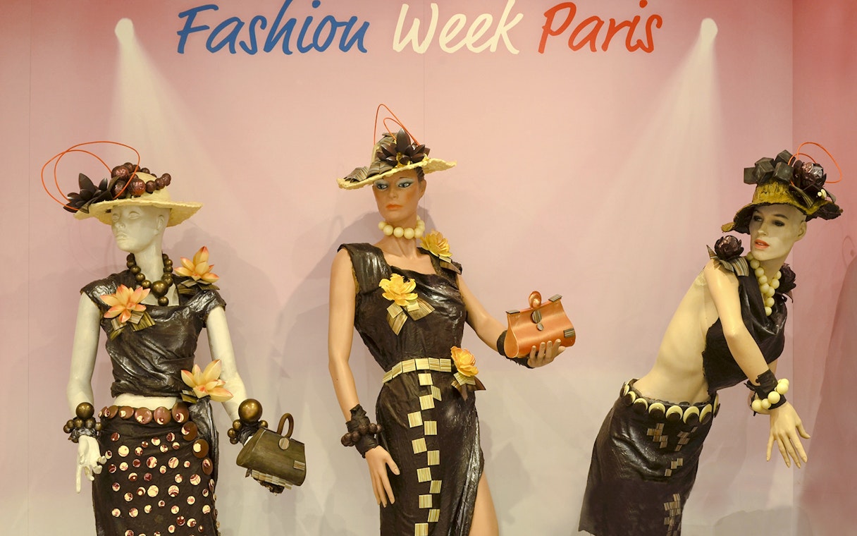 Mannequins in chocolate-themed fashion at Chocolate Museum Paris exhibit.