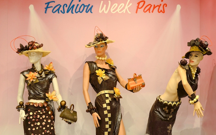 Mannequins in chocolate-themed fashion at Chocolate Museum Paris exhibit.