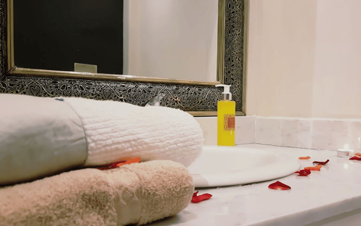Towels and soap on a marble counter at Moroccan Hammam, Marrakech.
