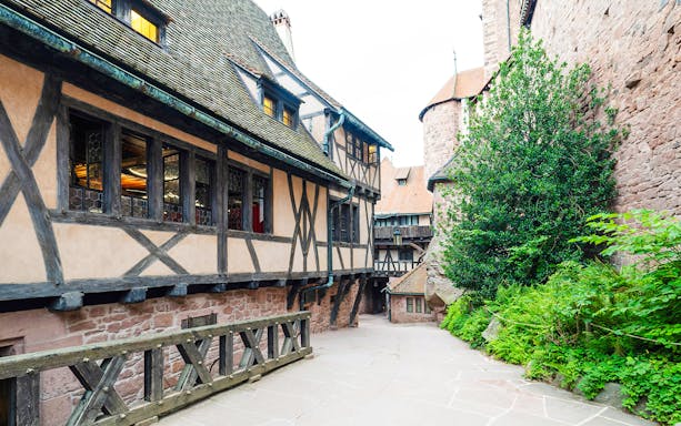 Medieval timber-framed alley inside Haut Koenigsbourg Castle, France.