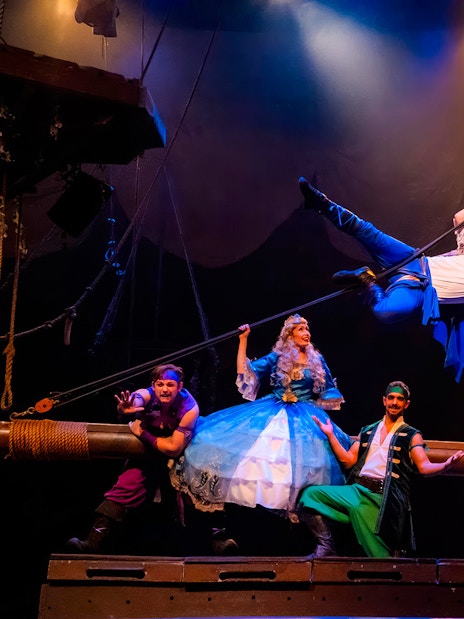 Pirates performing on stage at the Pirates Dinner Adventure Show.