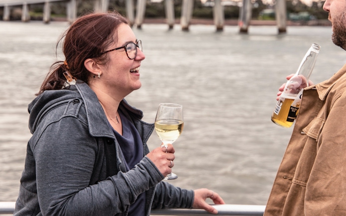 People enjoying drinks on a boat during a sunset sightseeing cruise at Phillip Island.