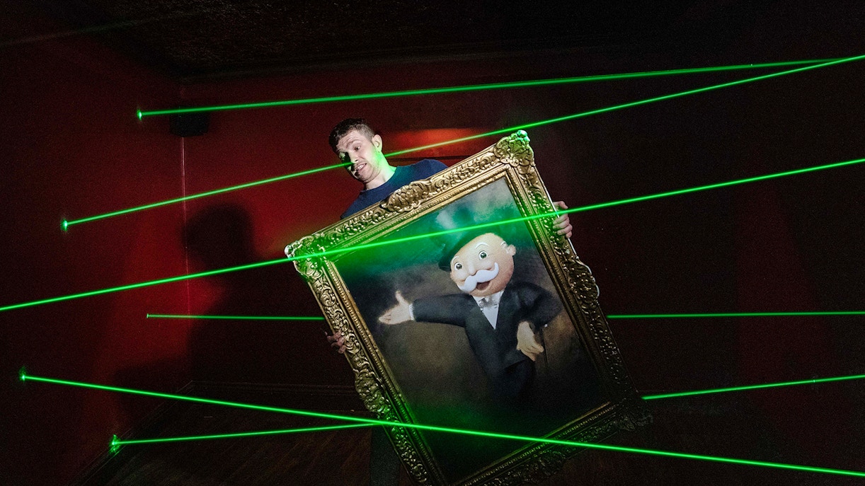 Guests playing a life-sized Monopoly game at Monopoly Lifesized experience in London.