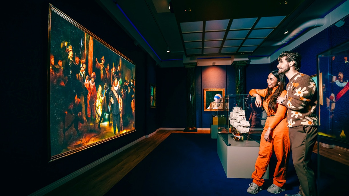 Guests viewing art and ship model at a museum in Holland.