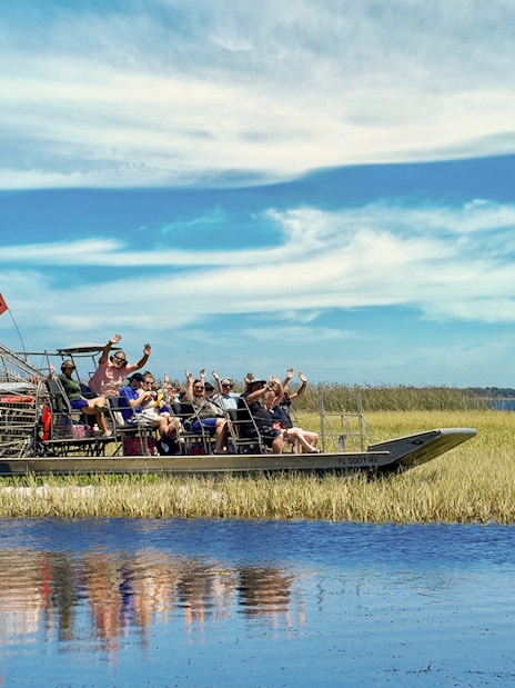 Guests on an airboat tour at Boggy Creek, enjoying the scenic wetlands.