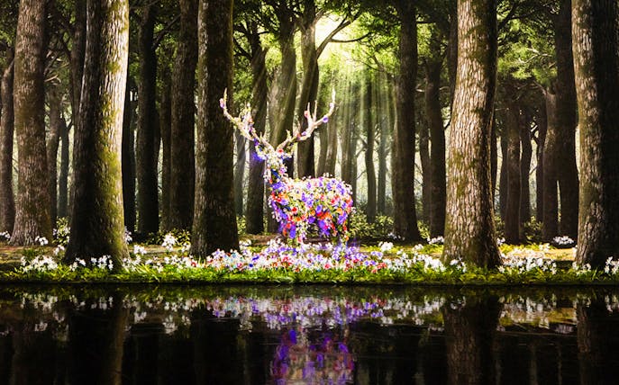 Floral deer sculpture in a forest at ARTE M Hong Kong.