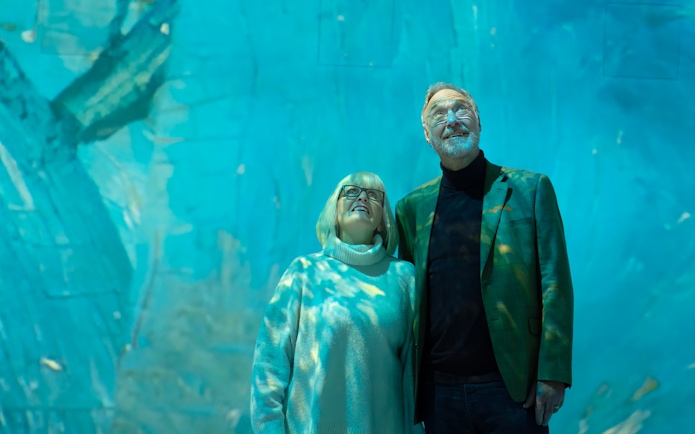 Tourists viewing immersive exhibit at Beyond Reality gallery.