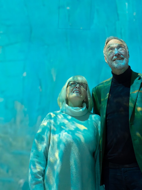 Tourists viewing immersive exhibit at Beyond Reality gallery.