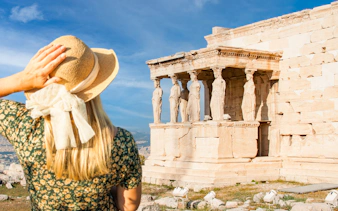 Woman admiring the Erechtheion on Acropolis Guided Bike Tour in Athens.