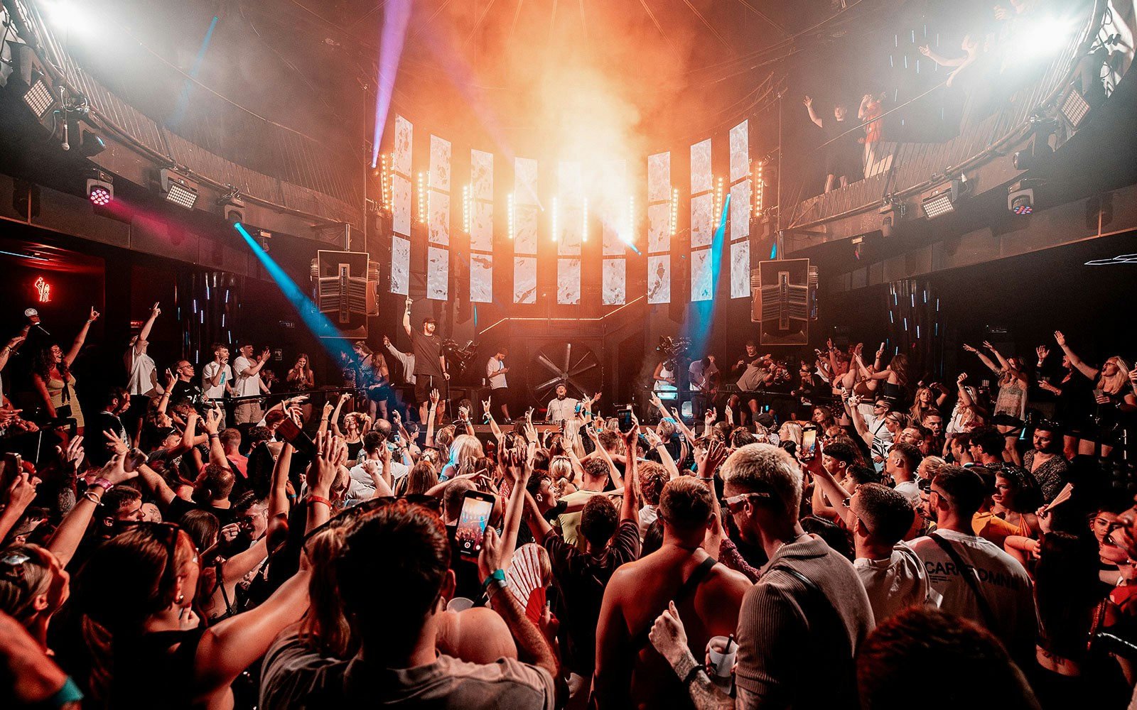 Crowd enjoying a DJ performance at Eden Ibiza nightclub.