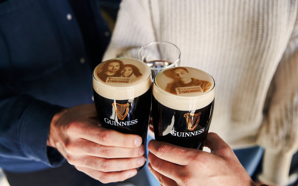 Guests enjoying personalized Stouties at Guinness Storehouse, Dublin.